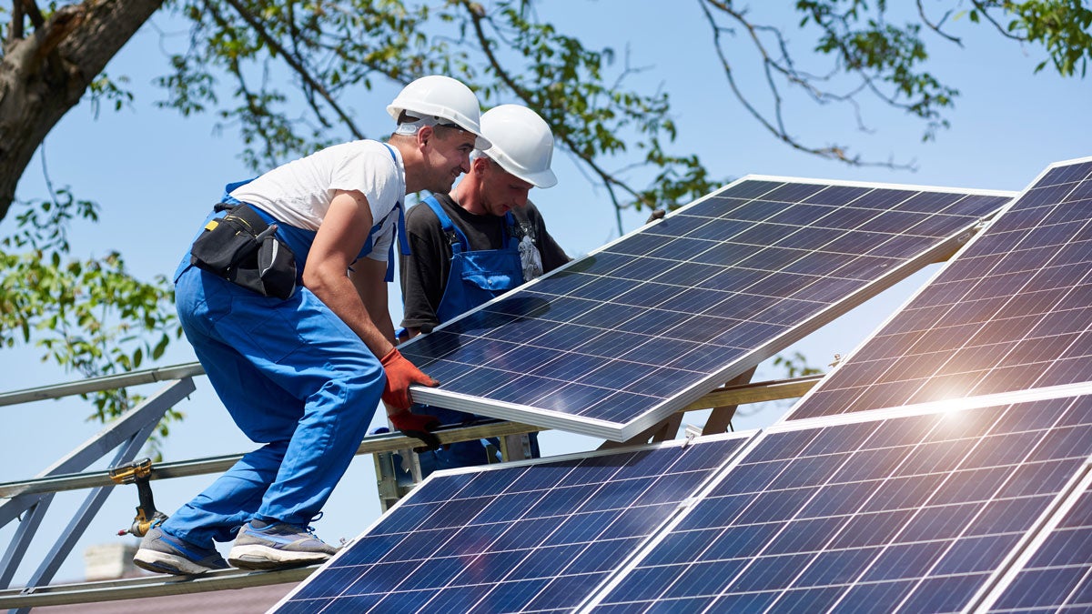 Stand-alone exterior solar panel system installation, renewable green energy generation concept.